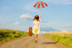 Personal Brand to protect and insulate young woman on country lane with umbrella
